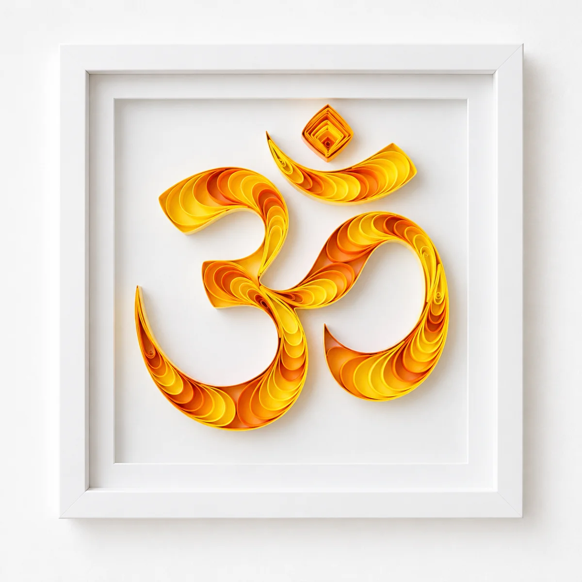 Sacred Aum quilled Om symbol in golden hues, white shadowbox frame